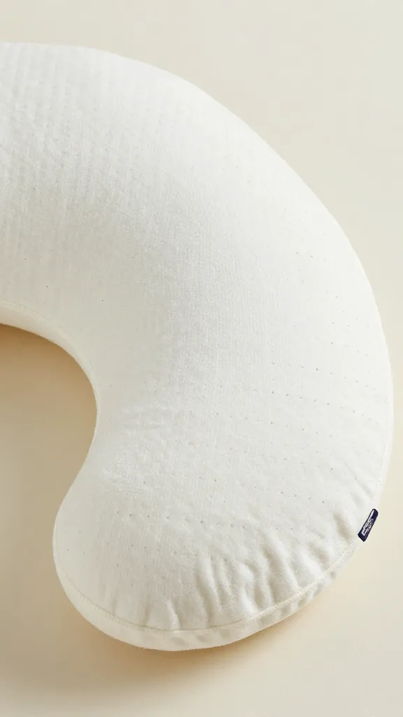 Closeup of a foam-filled nursing pillow with a breathable cotton cover